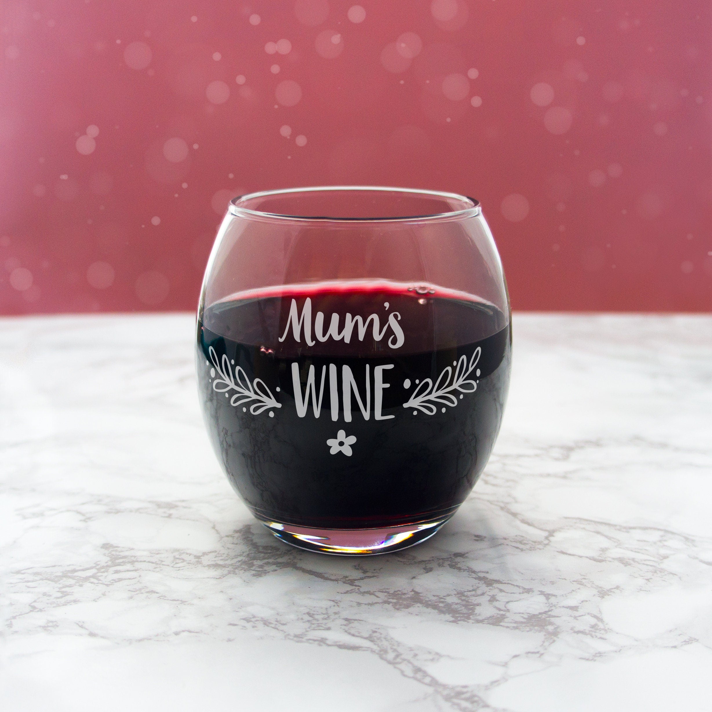 Stemless wine glass personalised with name and floral design. Custom engraved red, white wine glasses. Personalised gift for her mum