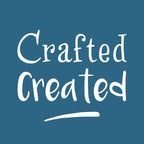 the phrase "Crafted Created" in a stylized font against a blue background.