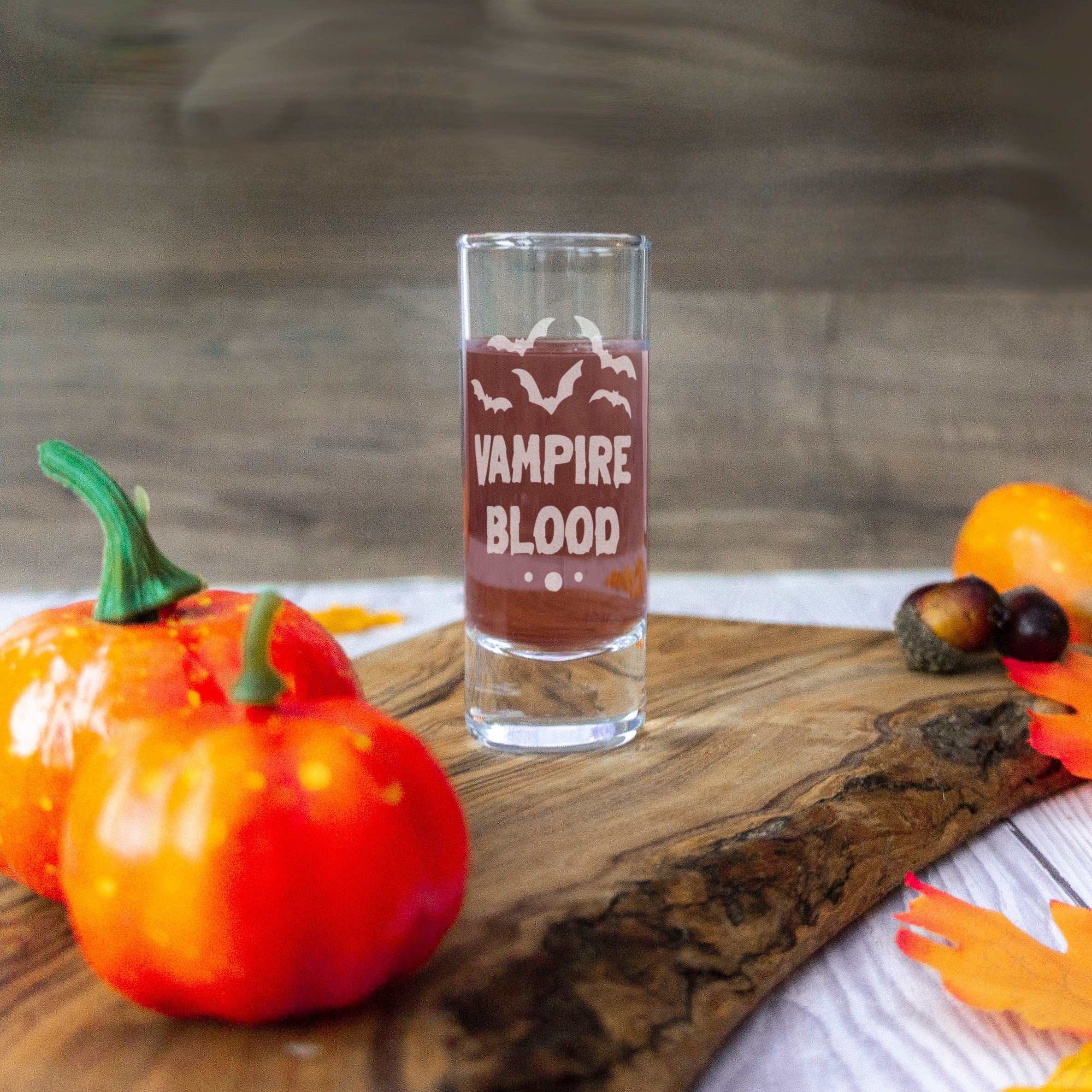 Vampire blood shot glass design for a halloween party home decor. Spirit drinks glass engraved with spooky design for halloween supplies