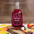 Halloween spirit glass decanter bottle engraved with spooky label design. Vampire blood drink for halloween party supplies