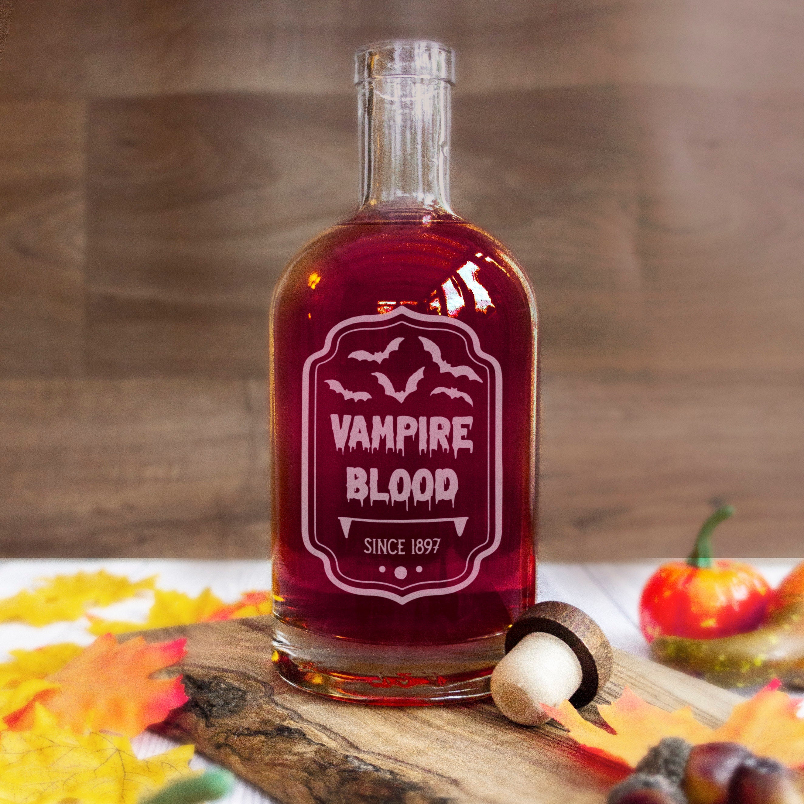 Halloween spirit glass decanter bottle engraved with spooky label design. Vampire blood drink for halloween party supplies