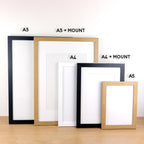 Framed photo print of new mother on cotton fabric.