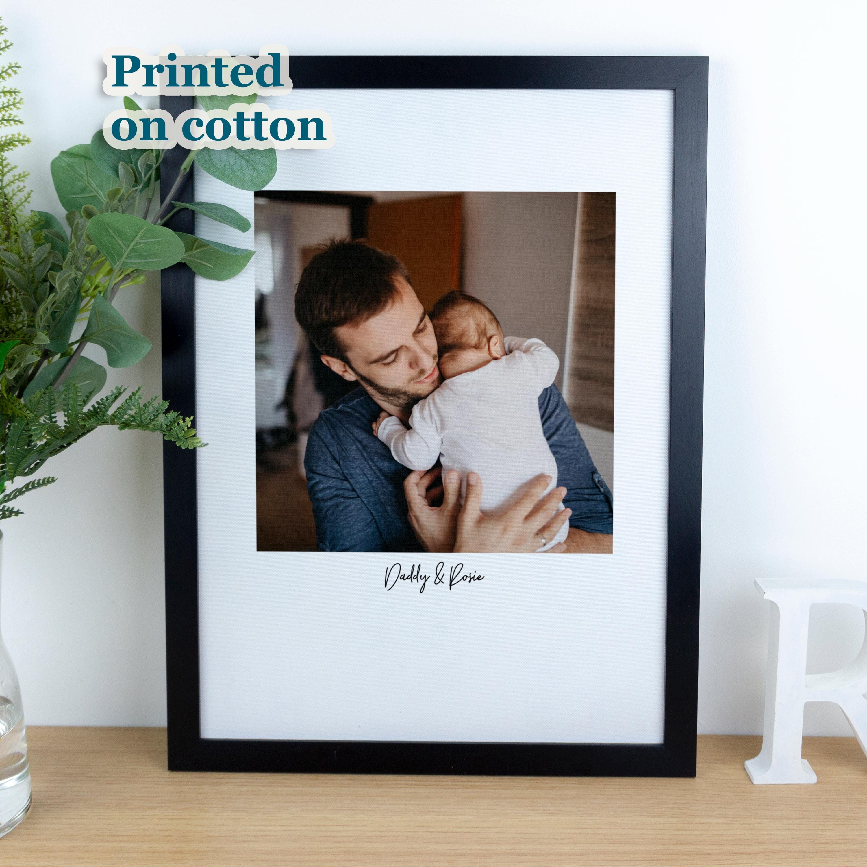 Framed cotton photo print of new dad printed on fabric.